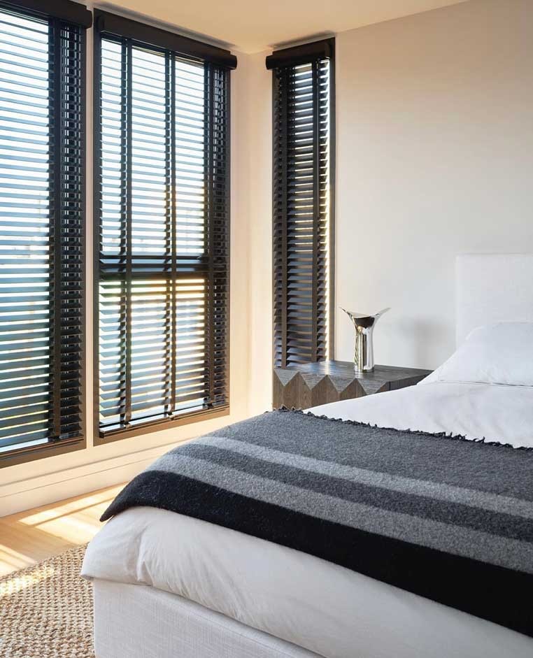 Bedroom with black shutters